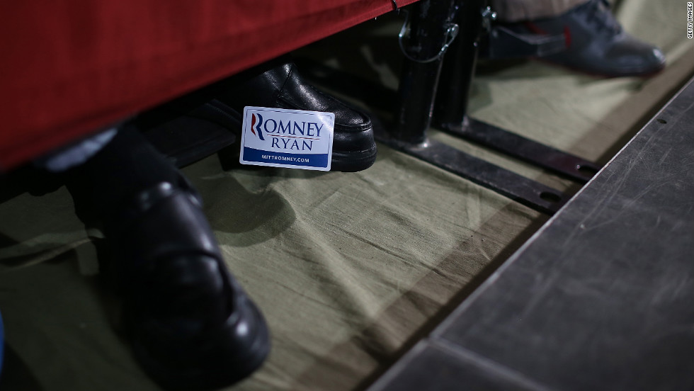 A supporter of Mitt Romney and Paul Ryan wears a campaign sticker on his shoe during a campaign rally at the Celina Fieldhouse in Celina, Ohio, on Sunday, October 28.