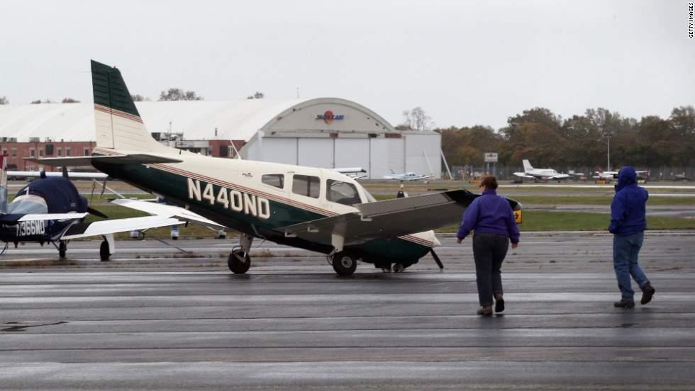 A small plane damaged in the storm sits on a runway in Farmingdale, New York, on Tuesday.
