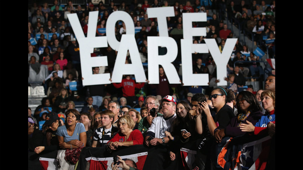 Democratic supporters listen during a campaign rally Monday with Clinton and Biden.