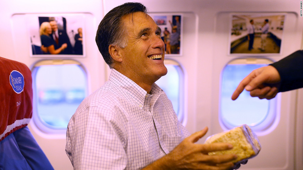 Romney holds a giant cinnamon roll on Monday en route to Dayton, Ohio. 