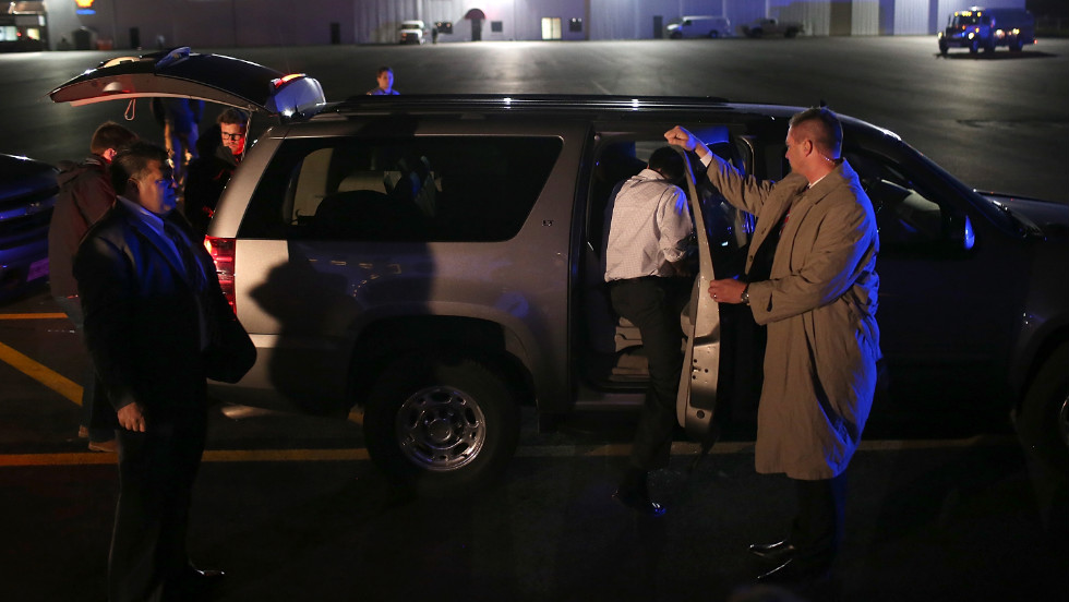 Romney gets into his SUV after landing Monday in Vandalia, Ohio.