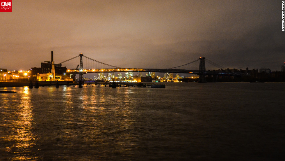 CNN iReporter Jordan Shapiro captured this view of the Williamsburg Bridge in New York at 11 p.m. on Tuesday, October 30. Half of the bridge and Brooklyn is lit, while the Manhattan side and the surrounding part of the island remain shrouded in darkness.