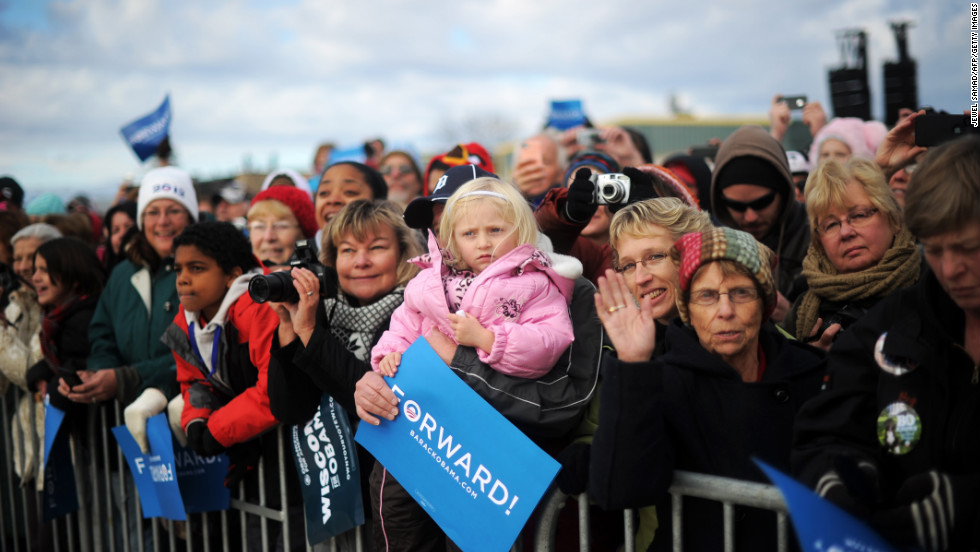 Supporters wait to hear President Obama during a campaign rally at Austin Straubel International Airport on Thursday.