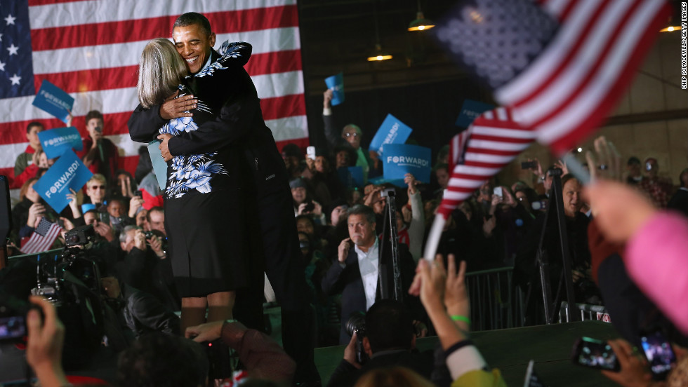 President Barack Obama embraces Judith Kamalay after she introduced him during a campaign rally Friday, November 2, in Hilliard, Ohio.