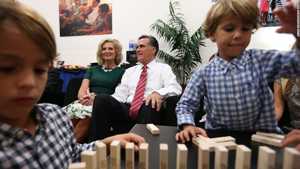 Mitt and Ann Romney sit backstage with members of their family before the final presidential debate in 2012.