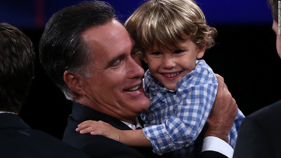 Mitt Romney holds his grandson Miles Romney at the conclusion of the final debate in 2012.