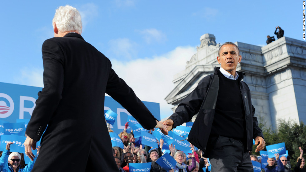 Obama is greeted by former President Bill Clinton during a campaign rally in Concord, New Hampshire, on Sunday, November 4. Obama and Romney darted from swing state to swing state, trying to fire up enthusiasm among supporters and win over any last wavering voters before Election Day.