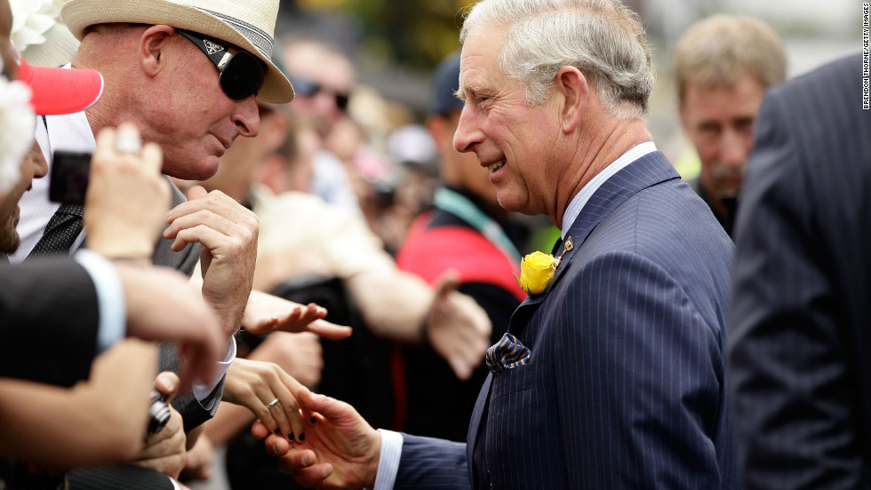 Prince Charles, Prince of Wales greets a racegoer on Melbourne Cup Day at Flemington Racecourse on November 6, 2012.