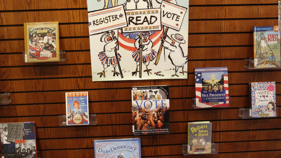 Children&#39;s books about politics lined a wall where citizens waited to cast their vote in Janesville, Wisconsin.