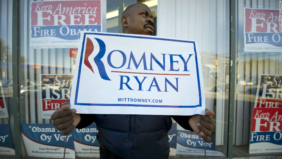 James Tate, 45, held a sign in support of the Republican ticket in Pittsburgh, Pennsylvania. 