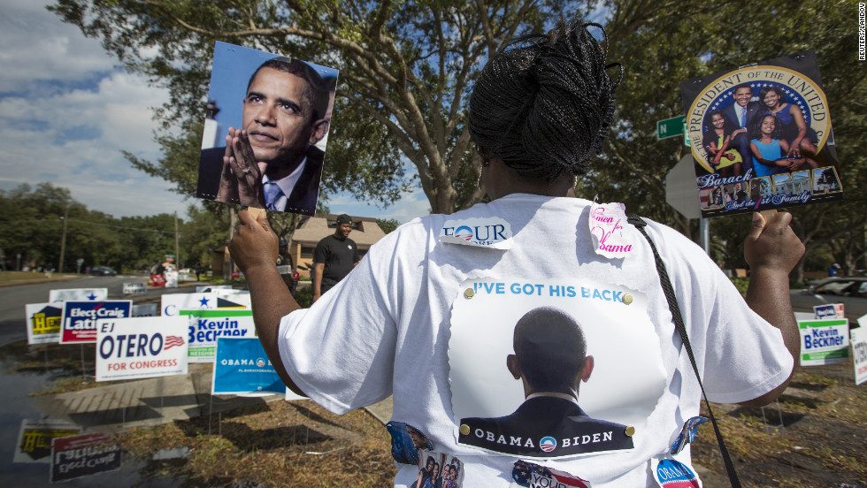 Obama supporter Tonya Lewis rallied for votes outside a polling station in Tampa, Florida.