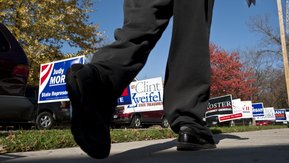 Voters walked past a plethora of campaign signs after casting their ballots at Immanuel Lutheran Church in Kansas City, Missouri. 