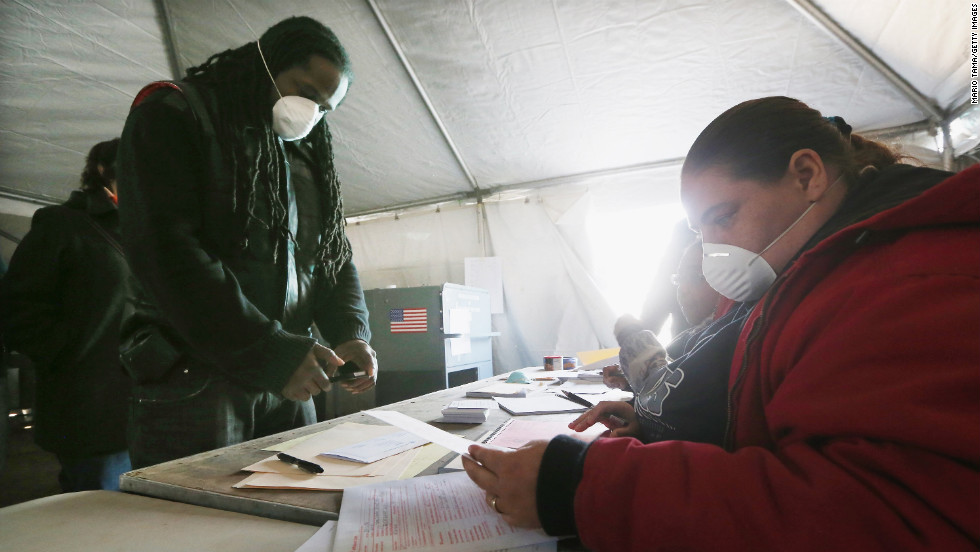 Jesse James, whose home was damaged by Superstorm Sandy, prepared to vote in a makeshift tent set up as a polling place in Rockaway Park, a neighborhood in Queens, New York. 