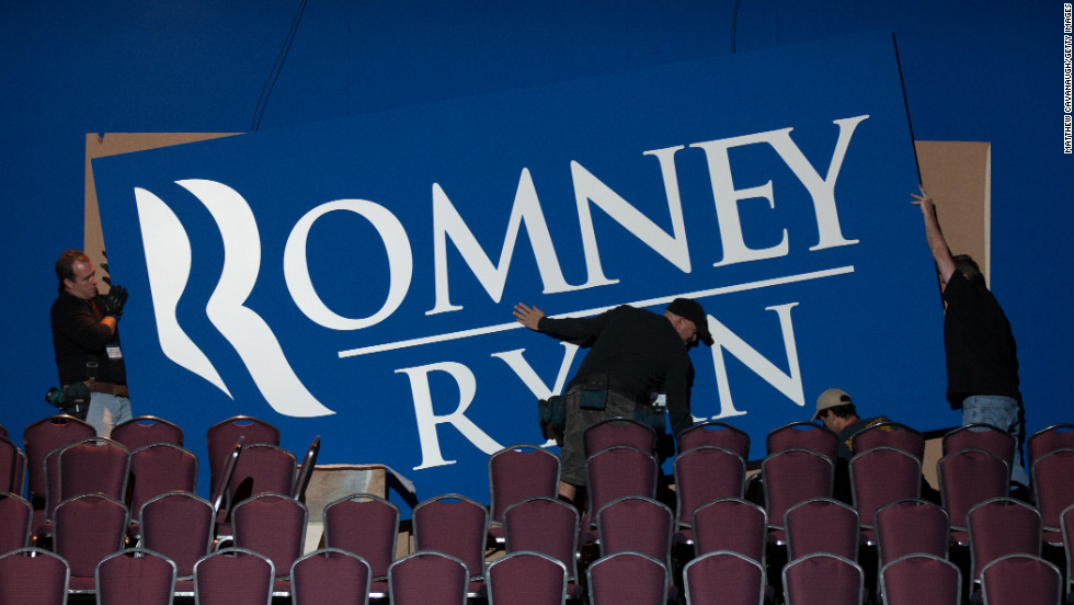 Workers put up signs Monday for Romney&#39;s election night event in Boston.