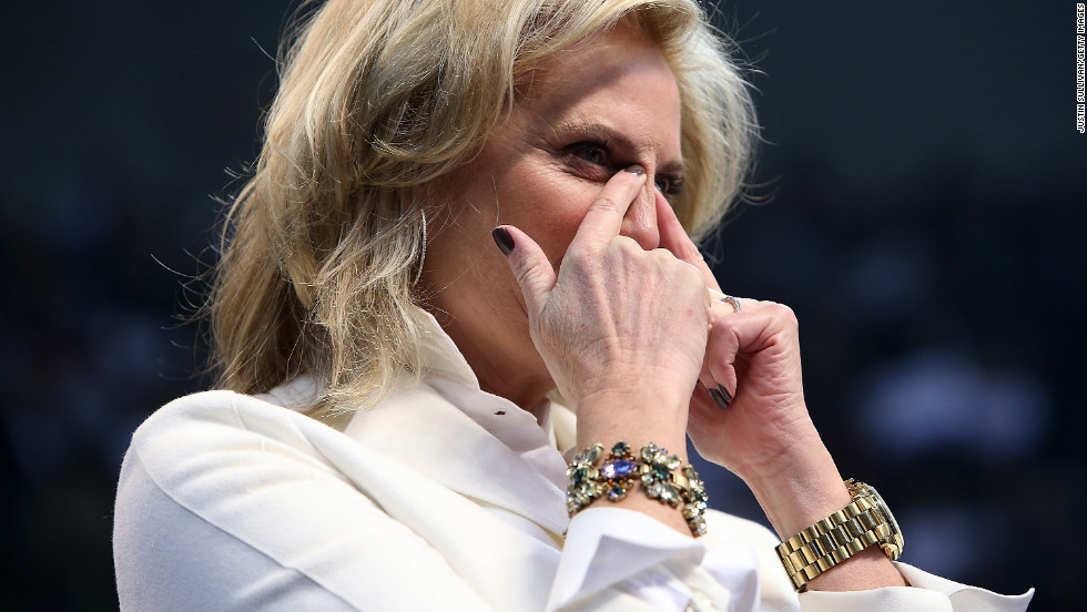 Ann Romney wipes away tears during her husband&#39;s campaign rally Monday in Manchester.