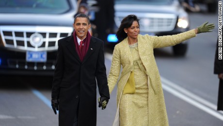 President Barack Obama and first lady Michelle Obama walk in the 2009 inaugural parade.