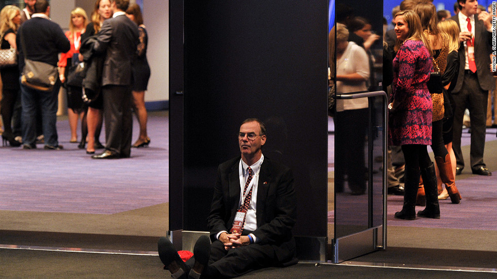 A dejected supporter of Republican candidate Mitt Romney slumped on the floor in Boston, Massachusetts.