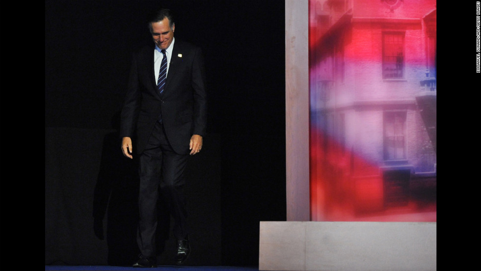 Republican candidate Mitt Romney hung his head and smiled as he strode onto the stage to give his concession speech. 