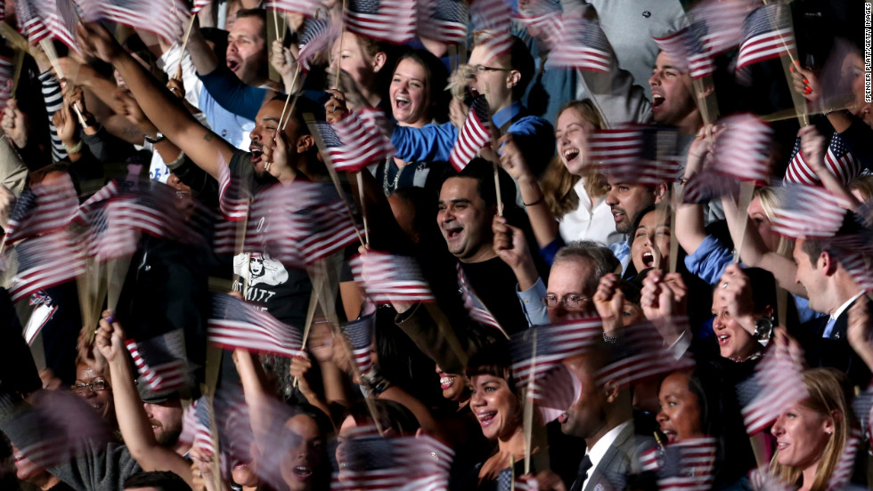 A blur of waving flags greeted President Barack Obama&#39;s victory speech at an election night event in Chicago, Illinois.