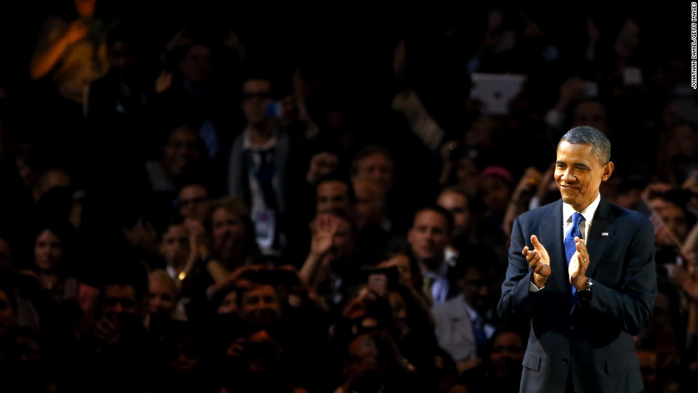 President Barack Obama clapped onstage in Chicago as the crowd cheered his reelection. 