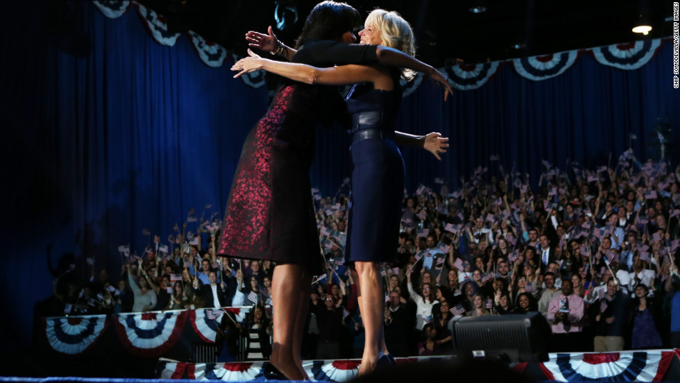 First lady Michelle Obama and Dr. Jill Biden hugged and will spend four more years in the public eye.  