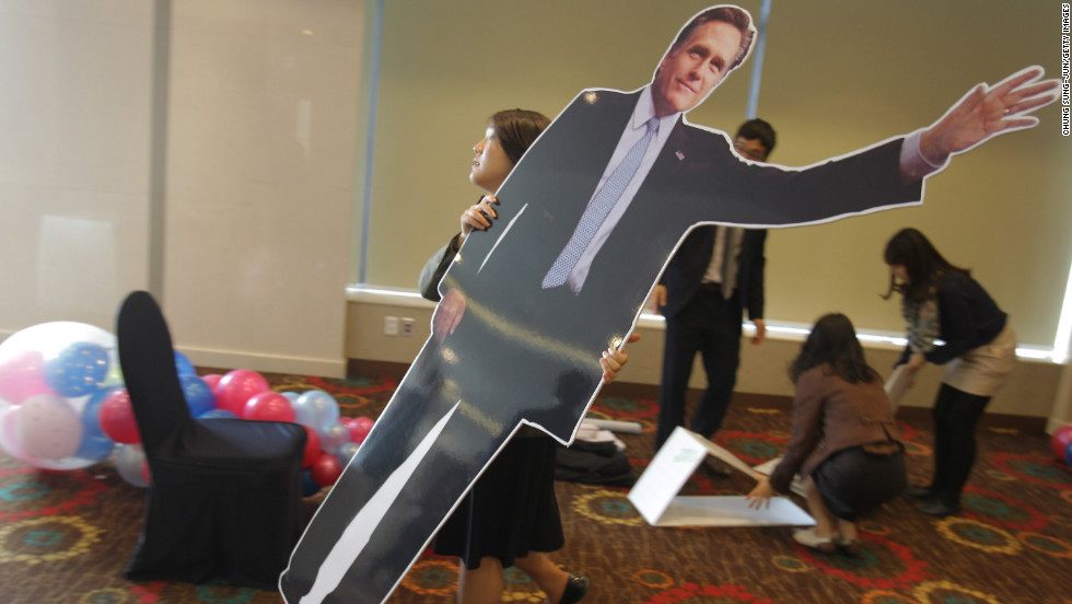 A South Korean woman carried a cardboard cutout of Republican Mitt Romney at an election night party in Seoul. South Koreans watched the race closely. 