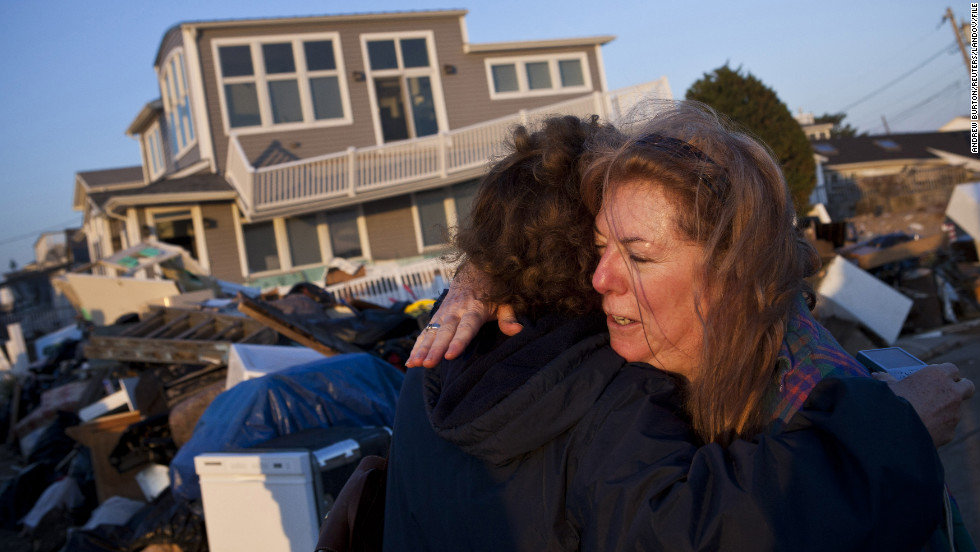 Evelyn Faherty hugs a friend on Sunday, November 11,&lt;strong&gt; &lt;/strong&gt;while discussing the damage done to her home by Superstorm Sandy in the Breezy Point neighborhood of Queens, New York.