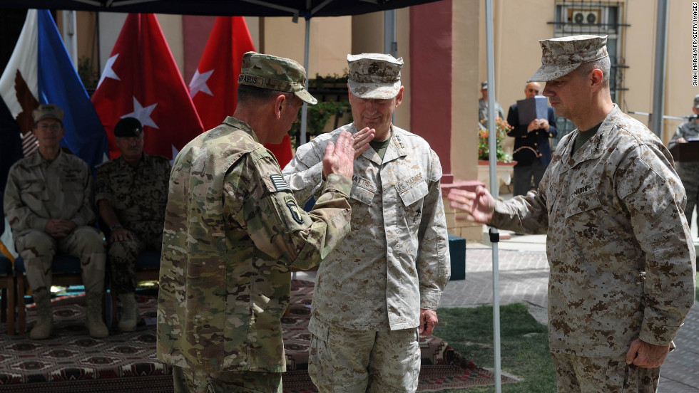 Petraeus, left, salutes his replacement as leader of the Afghanistan war, Gen. John Allen, right, and Gen. James Mattis during a change of command ceremony in Kabul, July 2011.