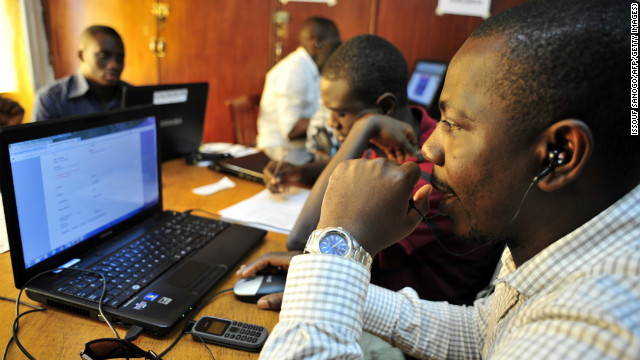 Observers for Sierra Leone&#39;s National Election Watch check computers in Freetown, November 16, 2012, ahead of elections.