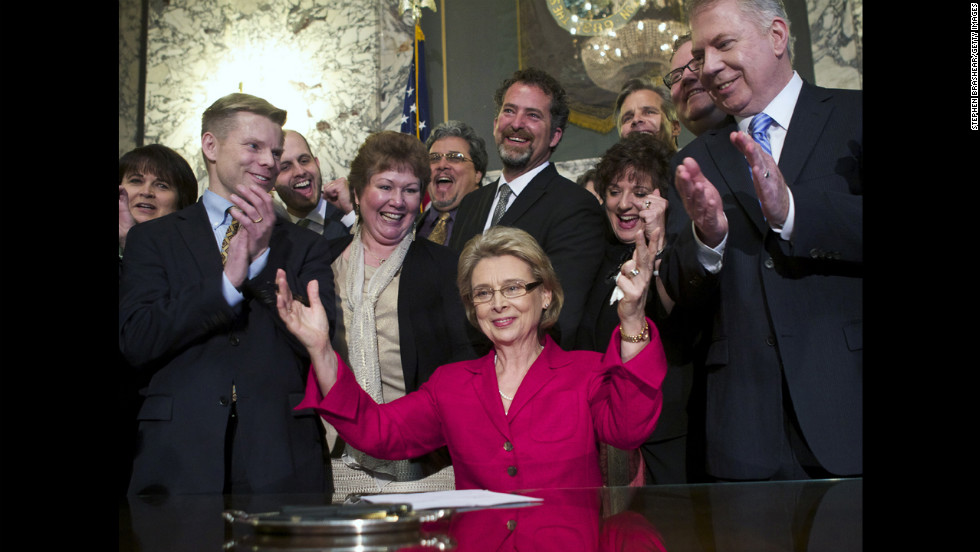 On February 13, 2012, Washington Gov. Chris Gregoire celebrates after signing marriage-equality legislation into law. Voters there approved same-sex marriage in November 2012, defeating a challenge by opponents.