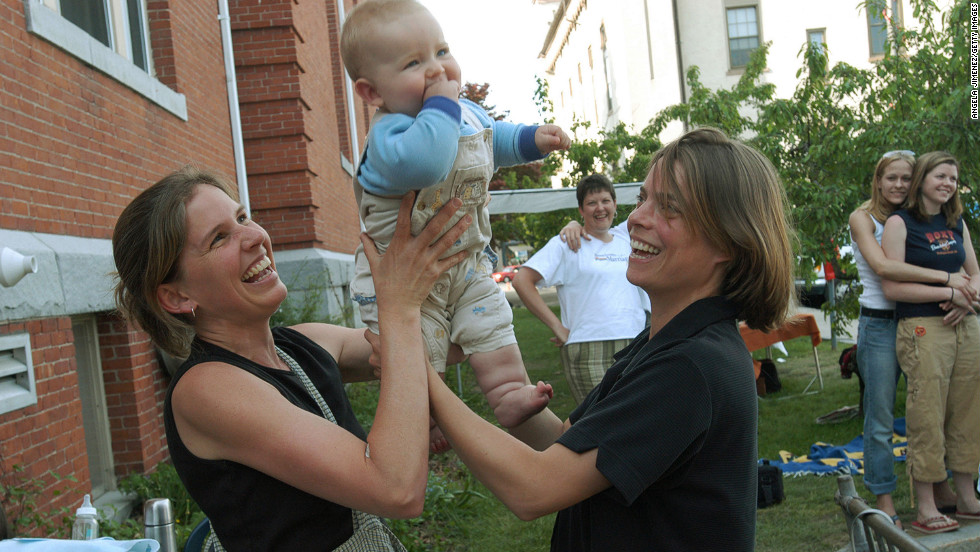Lara Ramsey, left, and Jane Lohmann play with their 7-month-old son, Wyatt Ramsey-Lohmann. The two wed in 2004 after Massachusetts approved same-sex marriage. Massachusetts was the first state to do so.