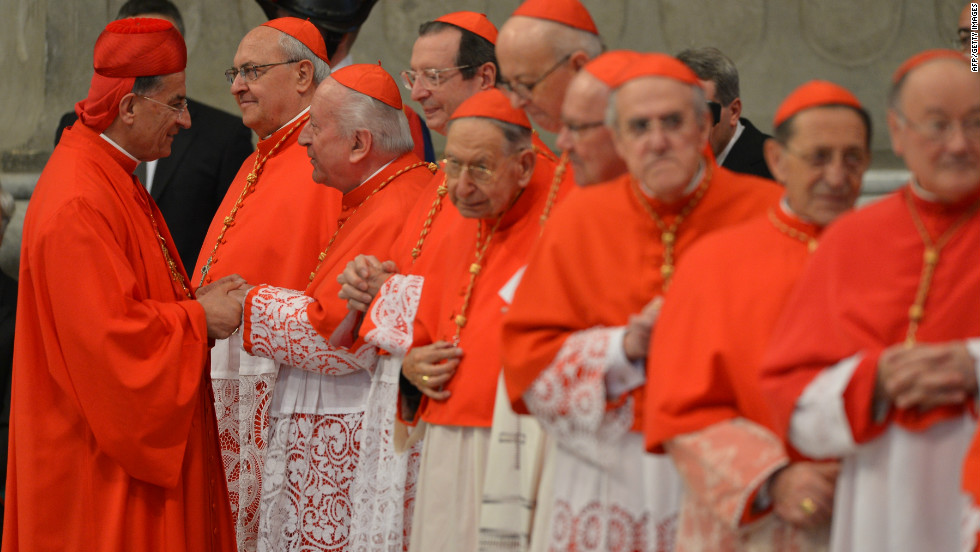 Lebanon&#39;s Bechara Boutros Rai (L), wearing his hat, is congratulated after Pope Benedict XVI appointed him as a cardinal.