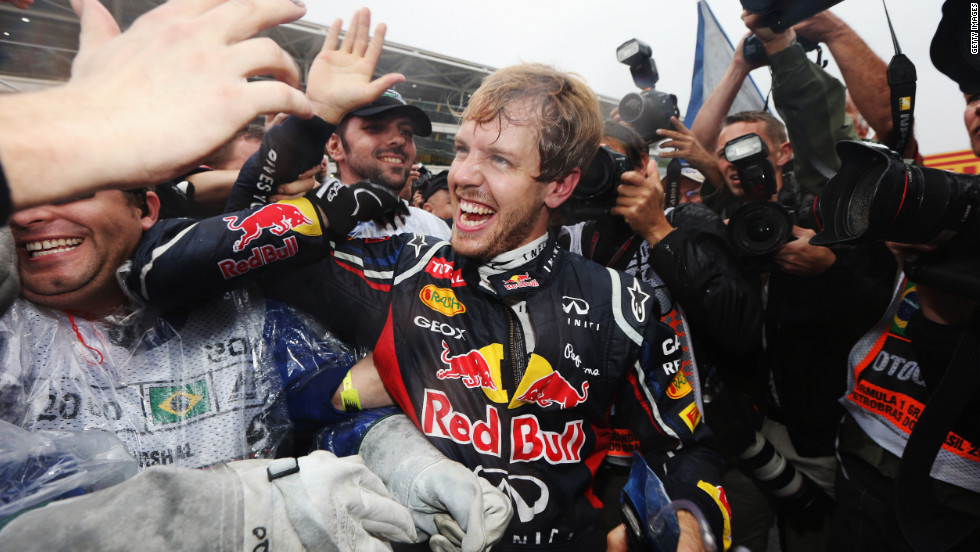 Vettel celebrates with his team and admirers after a pulsating race at Interlagos. There&#39;s sure to be a big party after another fantastic season for the German driver and the Red Bull team.