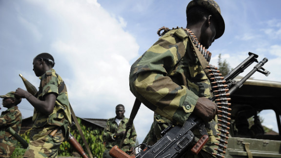 On November 26, M23 commanders refused to leave the city of Goma ahead of a midnight deadline imposed by regional leaders and the African Union. Pictured, rebel soldiers stand guard at the former Congolese army headquarters in Goma, on November 23, 2012.