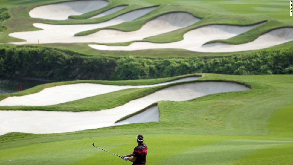 This year the Mission Hills group hosted a World Golf Championship tournament, the HSBC Champions, on a bunker-laden course at its Shenzhen complex designed by former Ryder Cup captain Jose Maria Olazabal. Ian Poulter is seen here on his way to winning the title.