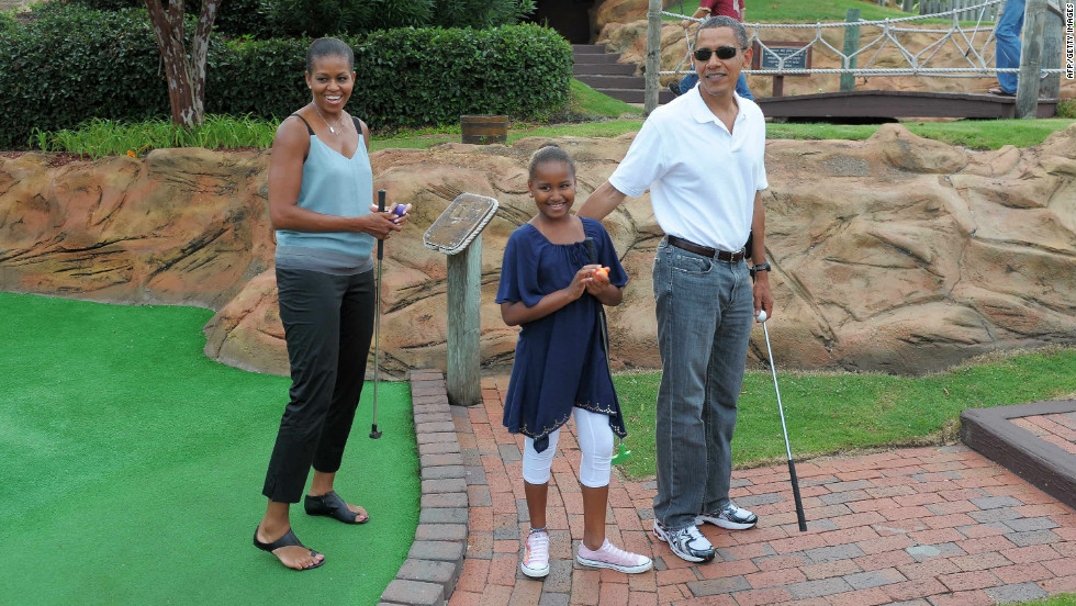President Barack Obama, his wife Michelle and daughter Sasha tried their hand at mini golf on a holiday in Florida in 2010.