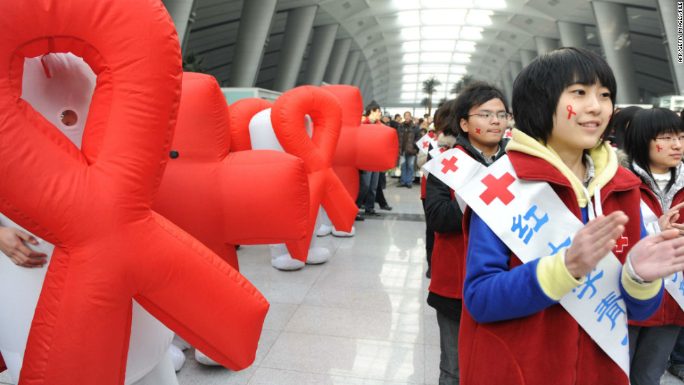 Volunteers from Red Cross China take part in an AIDS-awareness event on World AIDS Day in Beijing on December 1, 2009. 