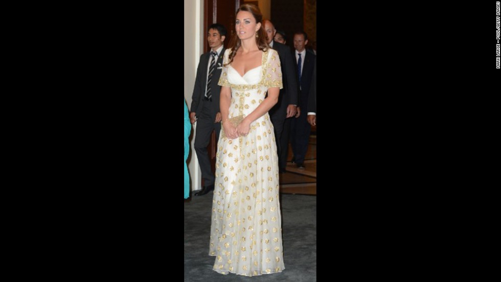 The duchess donned a white and gold gown by Alexander McQueen for a dinner hosted by Malaysia&#39;s head of state on September 13.