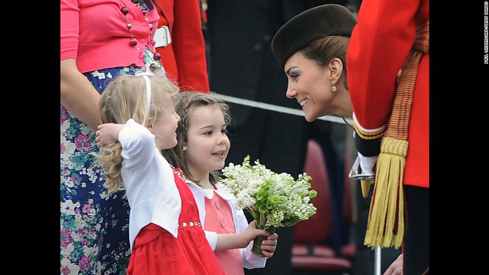 Catherine speaks with two young girls as she presents shamrocks to members of the 1st Battalion Irish Guards at the St Patrick&#39;s Day Parade on March 17, 2012, at Mons Barracks in Aldershot. 