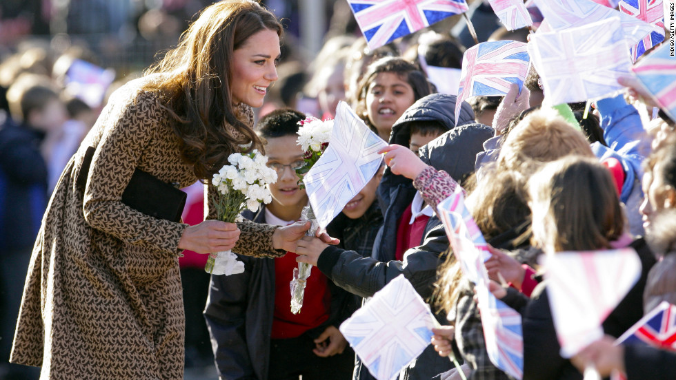 Catherine talks with flag-waving schoolchildren as she arrives for a visit to The Art Room&#39;s classroom at Rose Hill Primary School on February 21, 2012, in Oxford, England. Since the beginning of the year, Catherine has become patron of four charities, including the Art Room. 