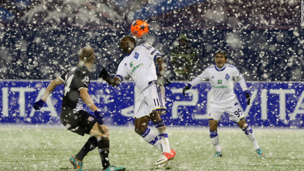 Dynamo Kiev&#39;s Ideye Brown fights for the ball with Dinamo Zagreb&#39;s Domagoj Vida in a game which was halted after 11 minutes following a snow storm in Croatia. The teams returned to the field after a 17 minute delay and played out a 1-1 draw