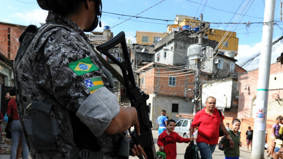 The Brazilian government has implemented programs to control violence in shantytowns around the country. Here an officer patrols one of Rio de Janeiro&#39;s favelas.