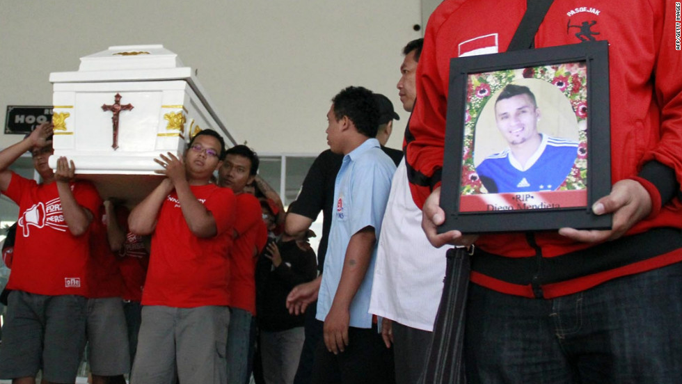Diego Mendieta&#39;s former teammates carry his coffin at the Paraguayan footballer&#39;s funeral in Solo, Indonesia. 
