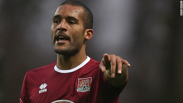 Clarke Carlisle in action playing for Northampton Town in 2012.