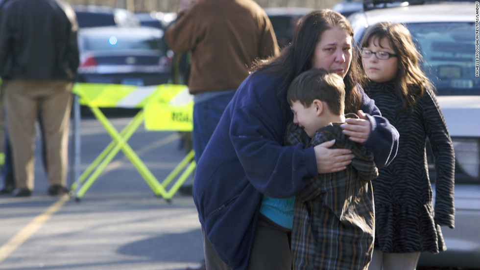 A young boy is comforted outside Sandy Hook Elementary School on December 14.