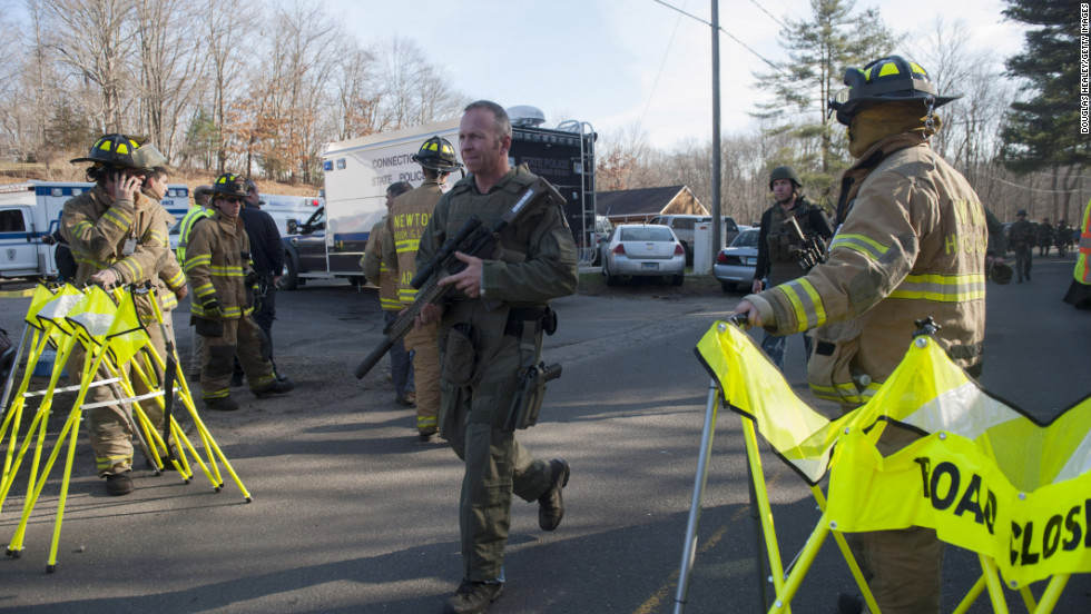 Connecticut State Police secure the scene of the shooting on December 14.