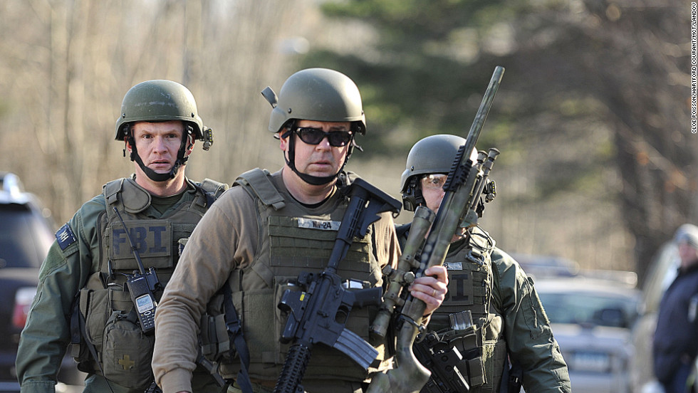 FBI SWAT team members walk along Dickinson Drive near Sandy Hook Elementary School on December 14.