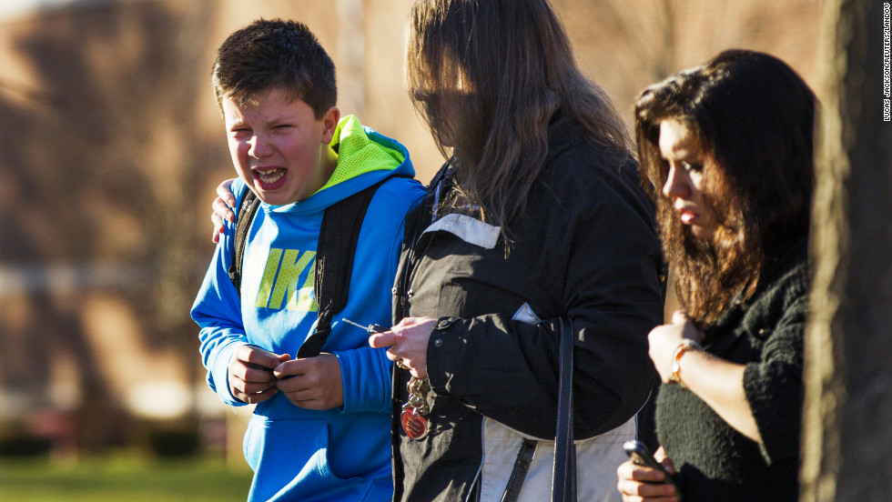 A boy weeps at Reed Intermediate School after getting news of the shooting at Sandy Hook Elementary School on December 14.