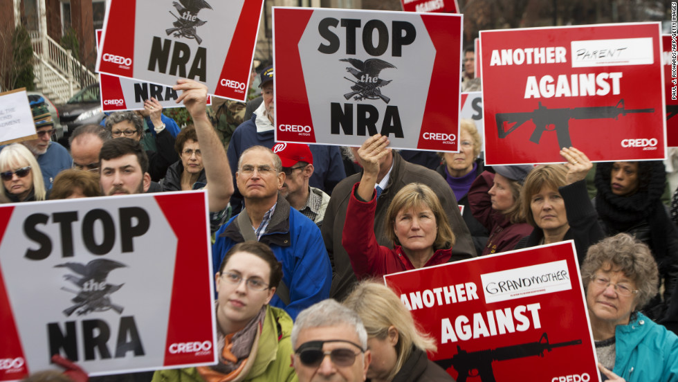 Protesters march on the National Rifle Association&#39;s Capitol Hill lobbyist offices in Washington on December 17.