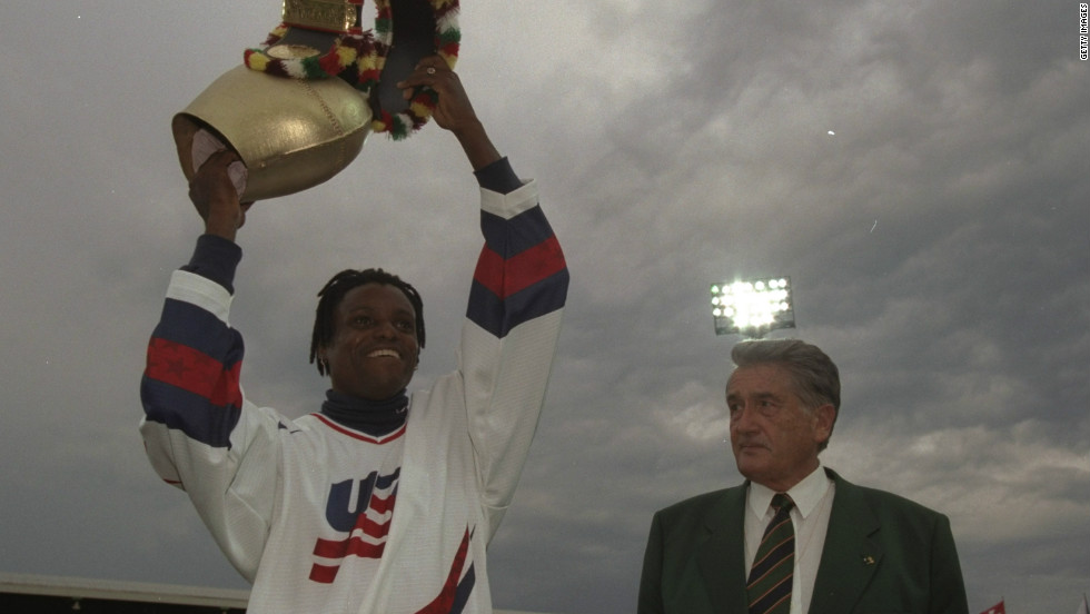 Cowbells have many different uses and are not just for skiing fans. Here American sprinter Carl Lewis of the USA is presented in 1997 with a huge cow-bell by promoter Andreas Brugger at the IAAF Weltklasse Grand Prix at the Letzigrund Stadium in Zurich, Switzerland.